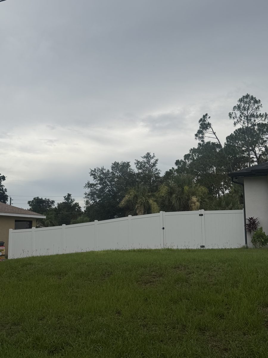 White vinyl privacy fence installed by Rodgers Services