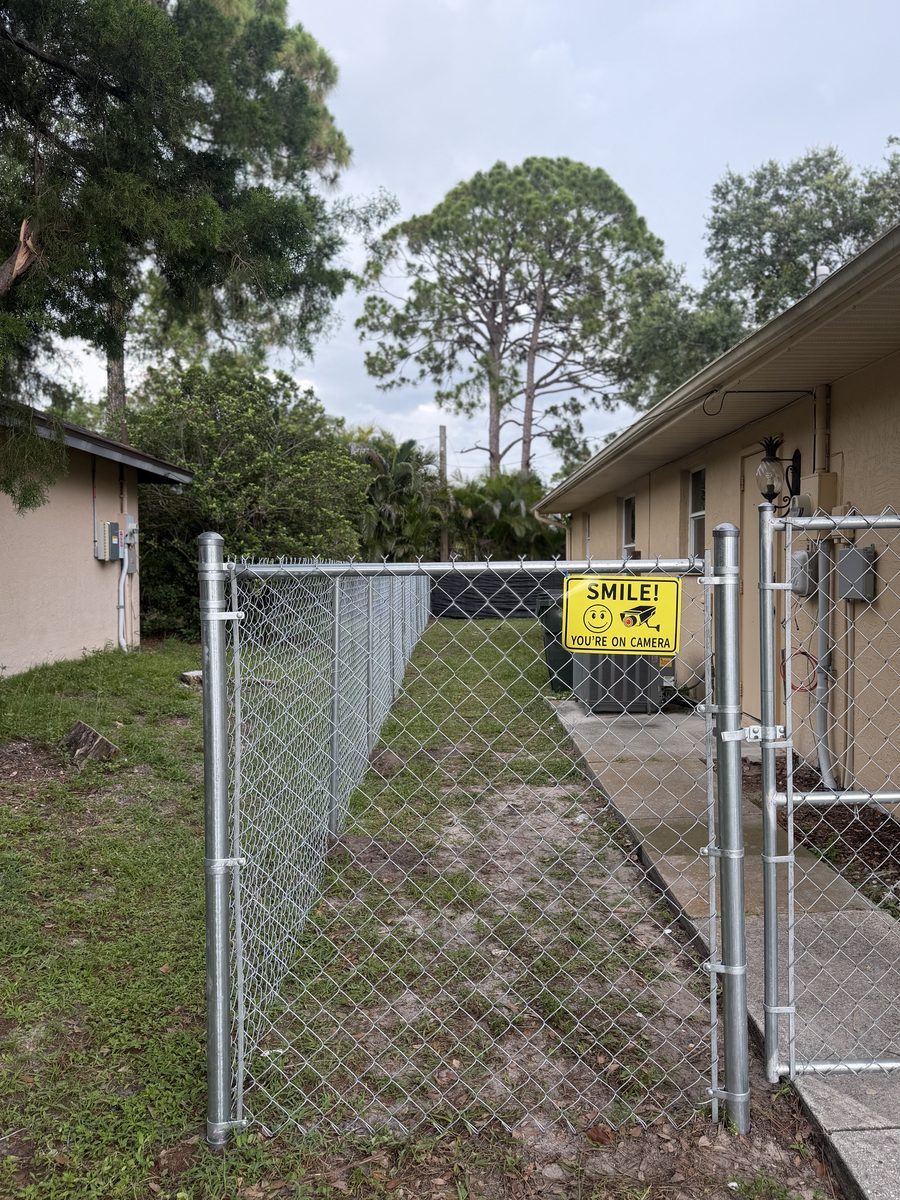 Galvanized chain-link fence with gate by Rodgers Services