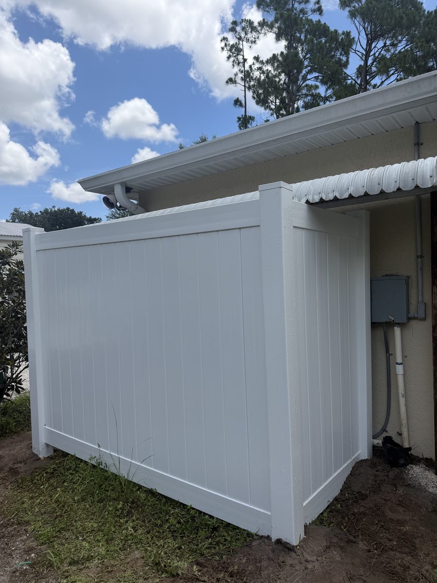 White vinyl fence enclosure by Rodgers Services